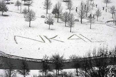The text "NK 4L" written in snow