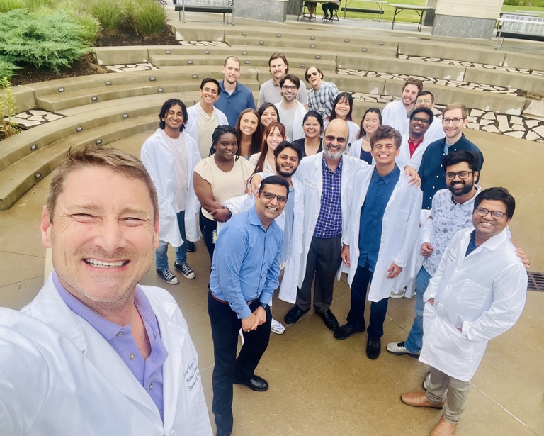 A selfie of Dr. Karandikar and Dr. Mangalam's lab members