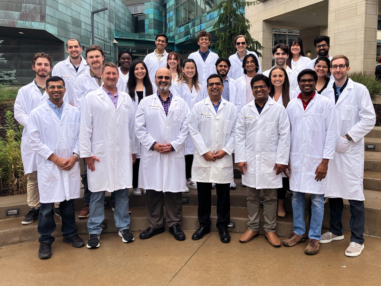Karandikar and Mangalam Lab Members in lab coats