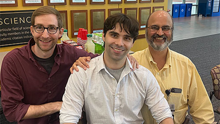 Alexander Boyden, Connor Wilhelm, and Dr. Karandikar smiling